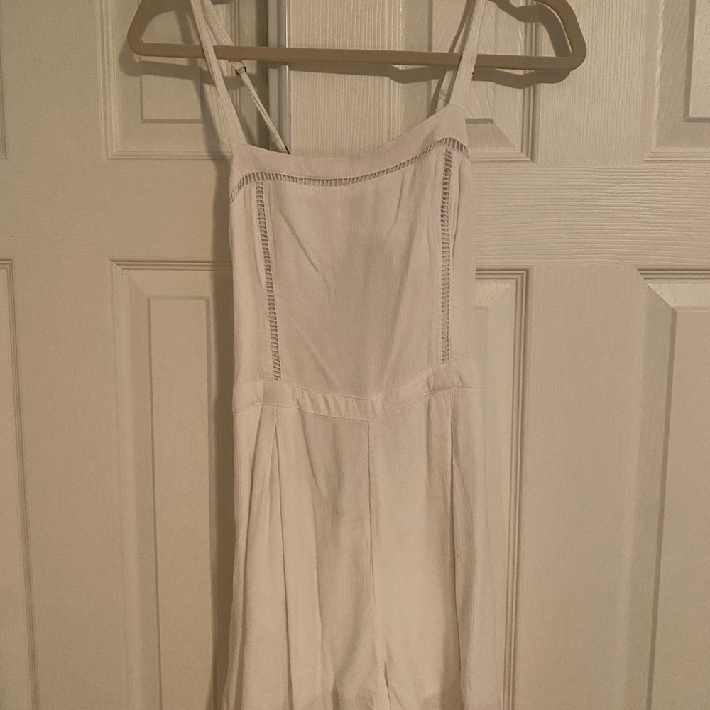 White flowy romper with tie in the back